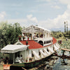 Boat on the River by Slim Aarons